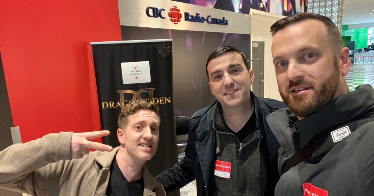 A selfie of 3 young male Caucasian NotaryPro executives, with the CBC logo in the background