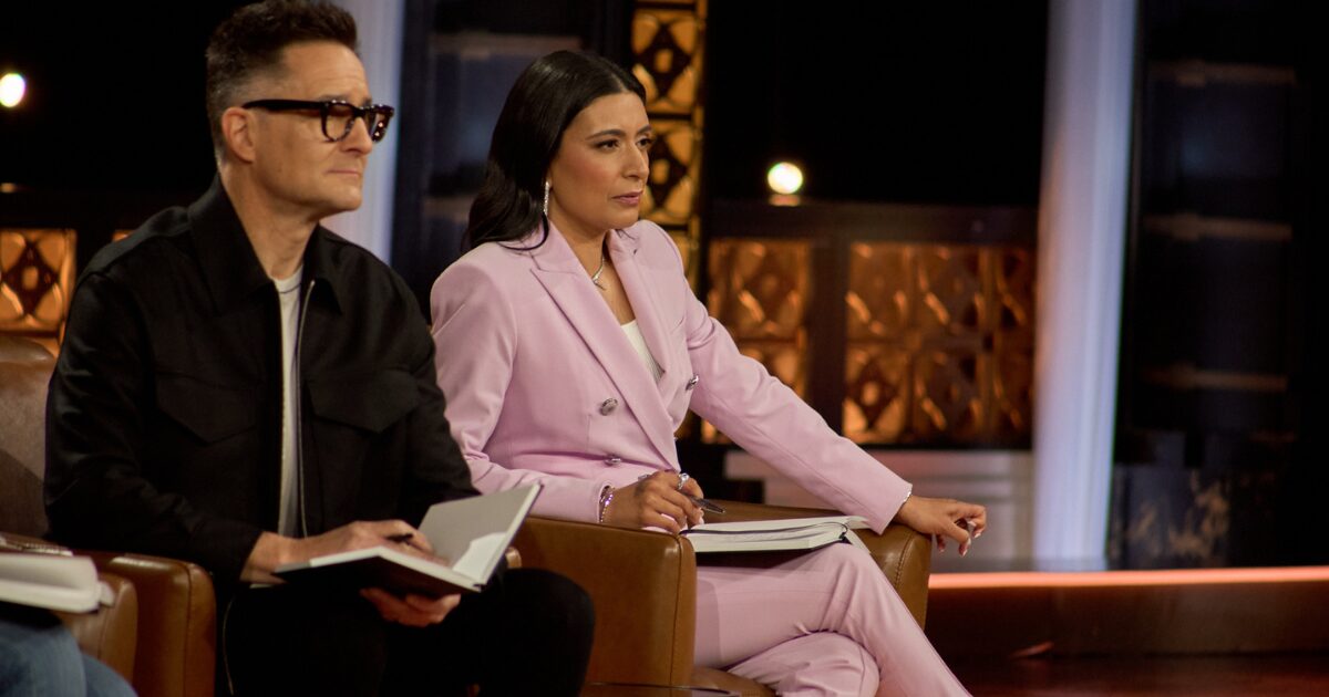 Dragons' Den investors, Brian Scudamore and Manjit Minhas sitting on their panel, listening to NotaryPro's pitch.